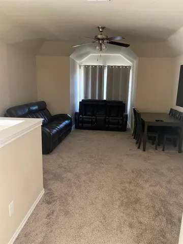 a room with furniture and a chandelier