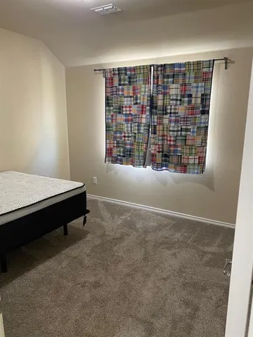 a view of livingroom with furniture and window