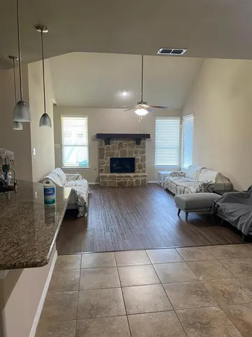 a living room with furniture and a fireplace