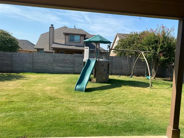 a view of a backyard with a slide