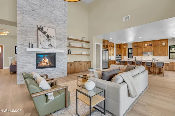 a large kitchen with a table and chairs