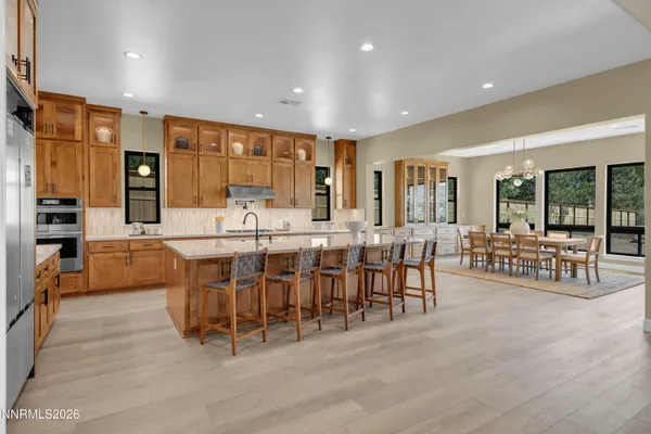a kitchen with kitchen island granite countertop wooden cabinets and counter space