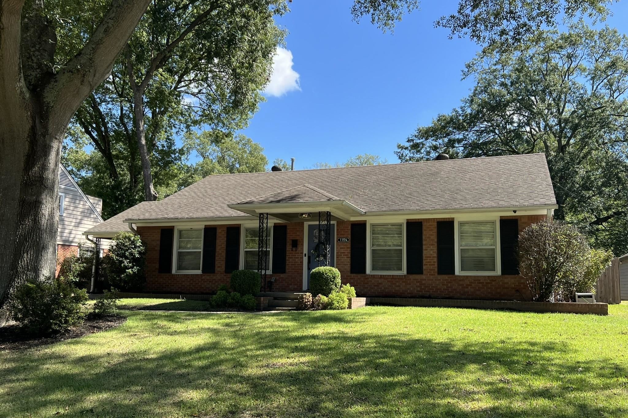 1104 West Perkins Road Memphis, TN 38117 - Photo 3 of 34 a view of a house with a yard