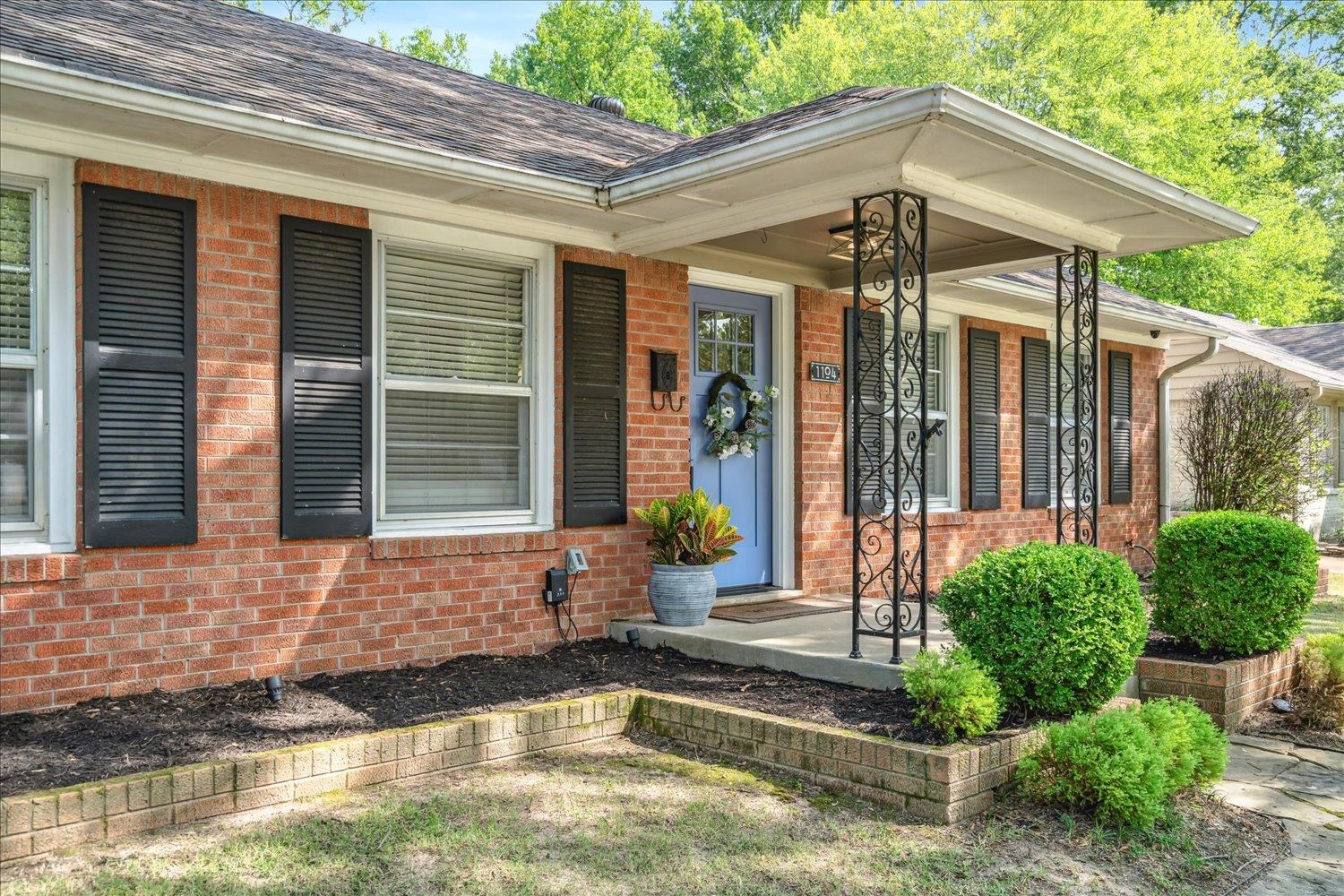 1104 West Perkins Road Memphis, TN 38117 - Photo 4 of 34 a front view of a house with swimming pool and porch