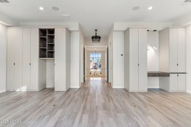 a bathroom with a double vanity sink mirror and shower