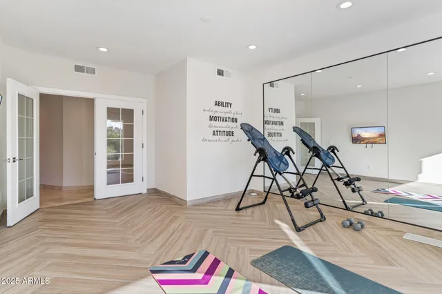 a room with furniture pool table and windows
