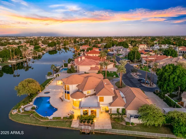 a view of swimming pool with a house in the background