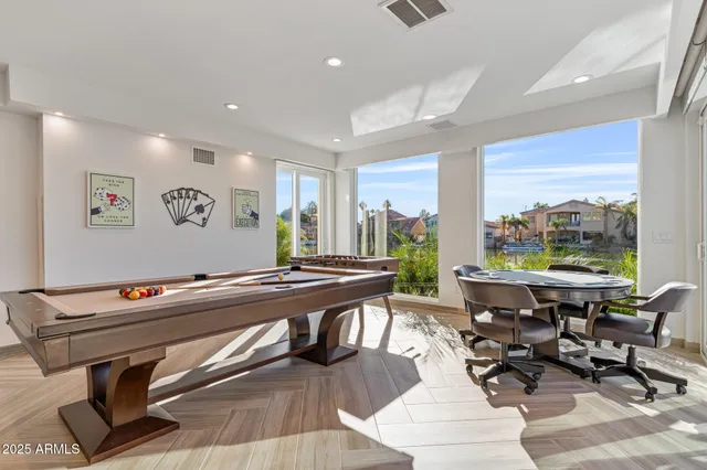 a view of a swimming pool with a yard and furniture