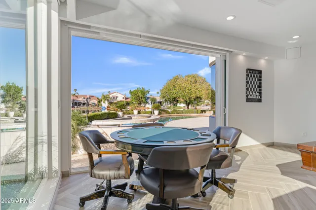 a view of a house with a big yard and large trees