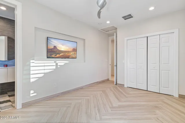 a view of a patio with table and chairs and potted plants