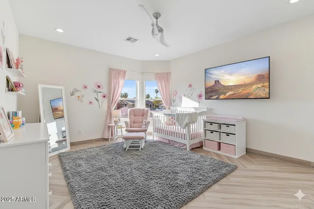 a lobby with furniture and potted plants
