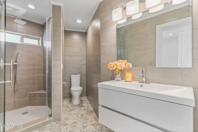 a view of a patio with a table chairs and a couple of chairs