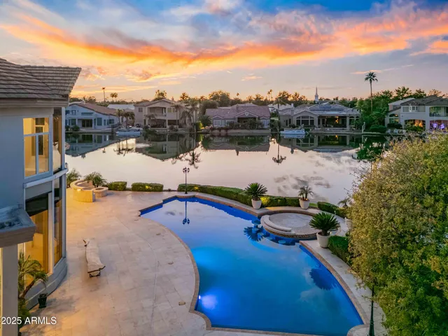 a view of a lake with houses in front of it