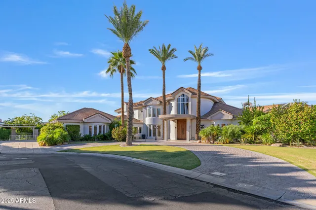 a living room with fireplace furniture and a large window