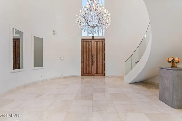 a living room with couches and a flat screen tv