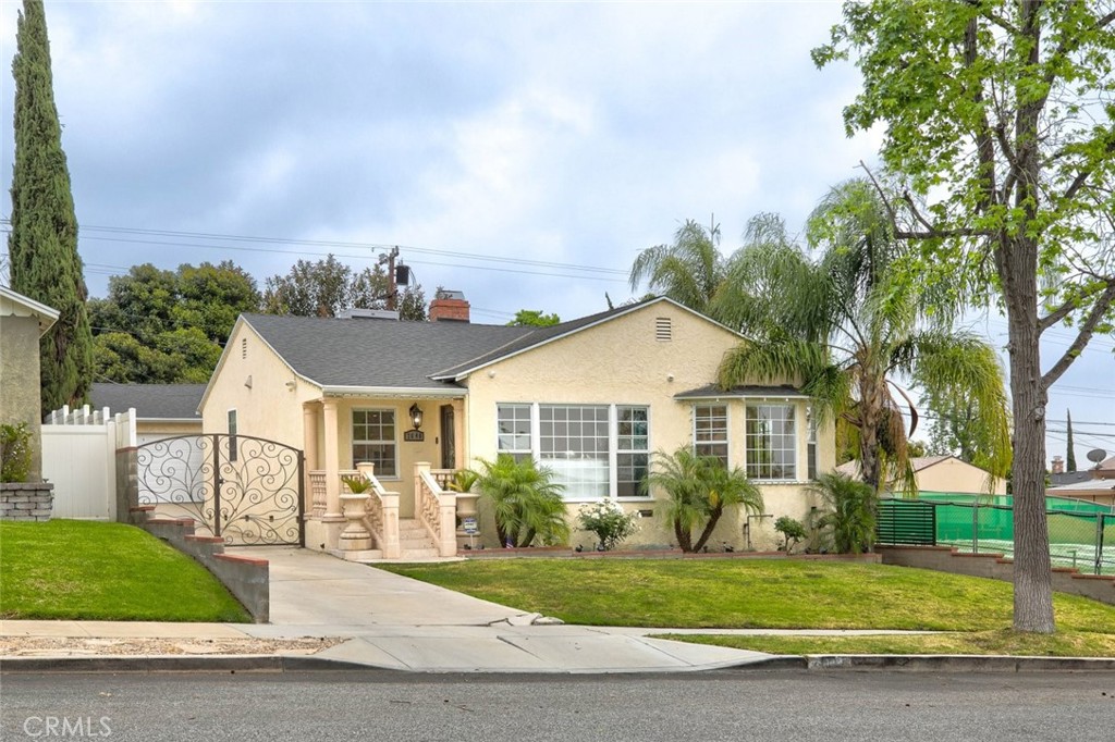 2640 North Keystone Street Burbank, CA 91504 - Photo 2 of 48 a front view of a house with a garden and plants