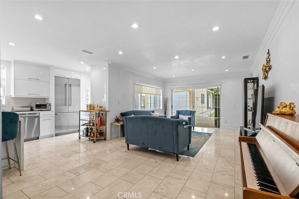 2640 North Keystone Street Burbank, CA 91504 - Photo 22 of 48 a living room with furniture and a open kitchen