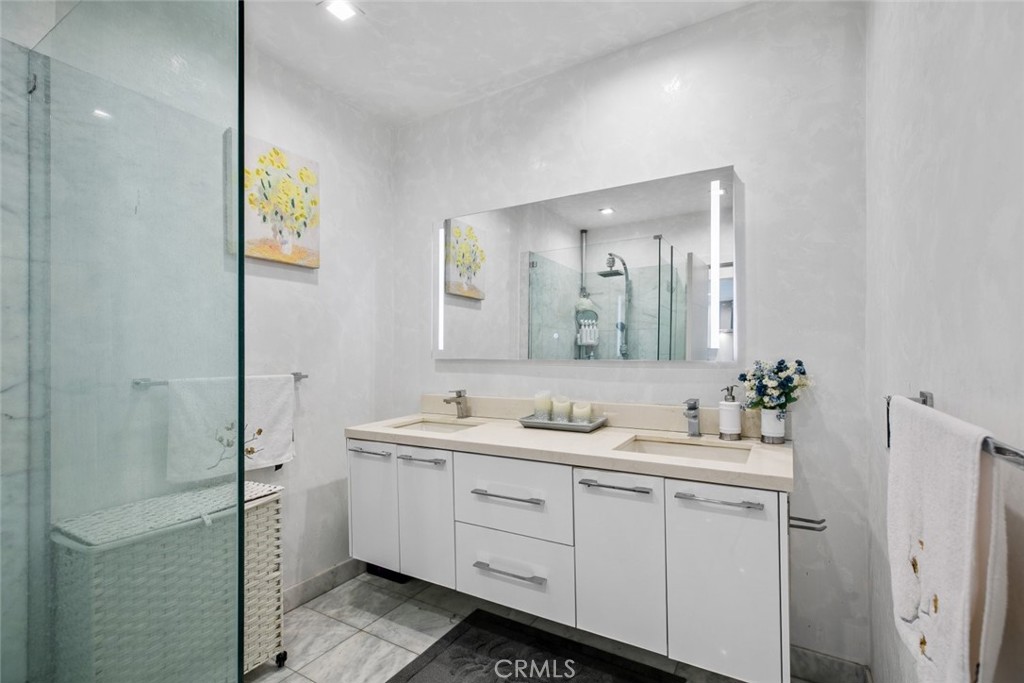 2640 North Keystone Street Burbank, CA 91504 - Photo 28 of 48 a bathroom with a double vanity sink and mirror