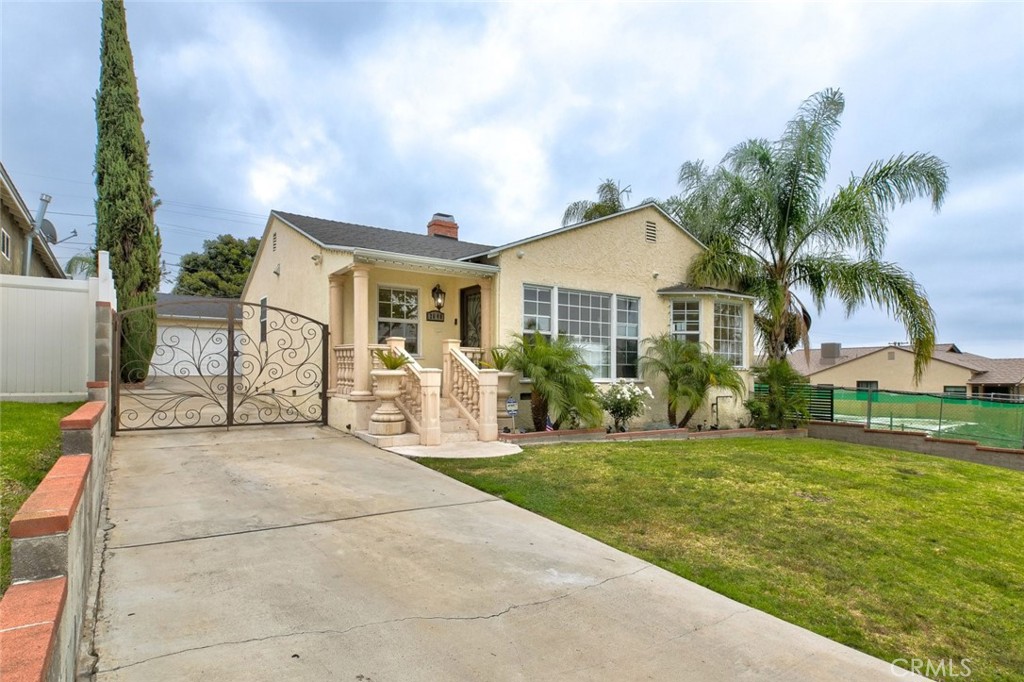 2640 North Keystone Street Burbank, CA 91504 - Photo 3 of 48 a view of a house with a yard and potted plants