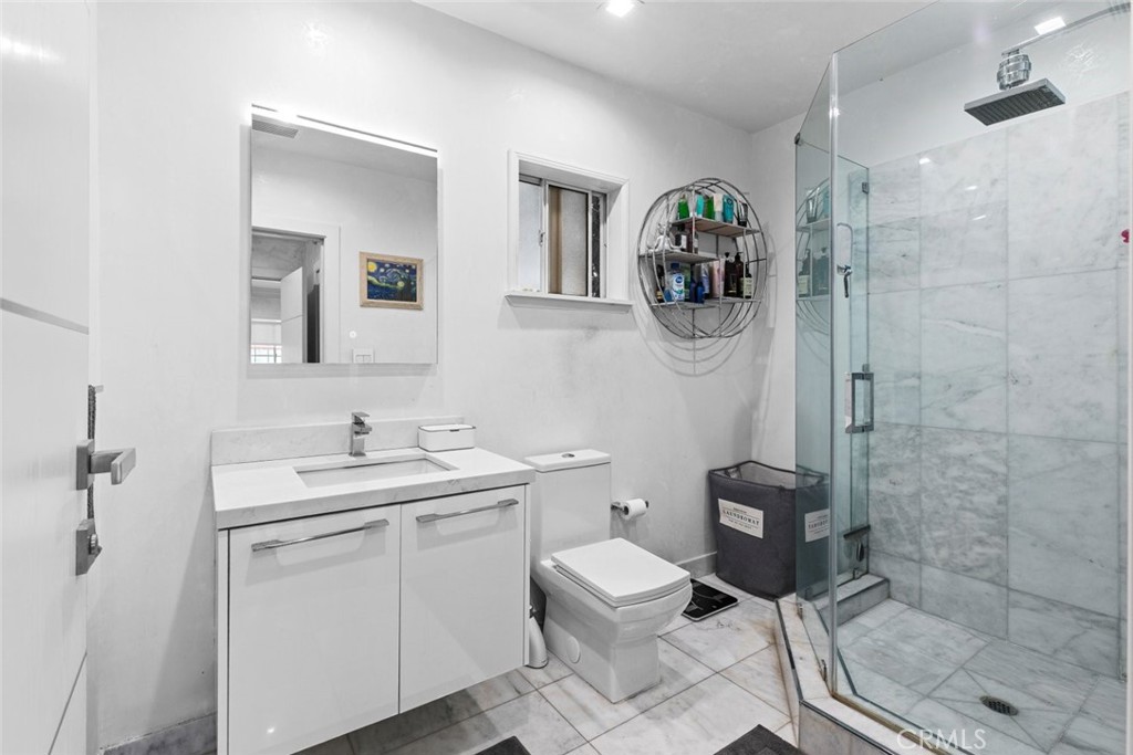 2640 North Keystone Street Burbank, CA 91504 - Photo 33 of 48 a bathroom with a sink a toilet and shower