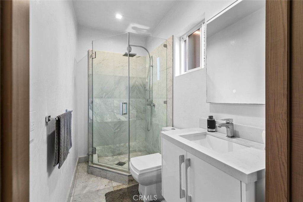 2640 North Keystone Street Burbank, CA 91504 - Photo 44 of 48 a bathroom with a shower sink vanity mirror and toilet
