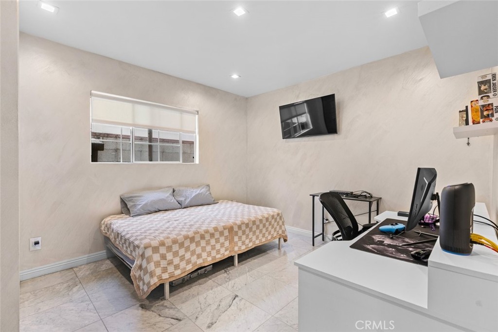 2640 North Keystone Street Burbank, CA 91504 - Photo 45 of 48 a bedroom with a bed and a desk