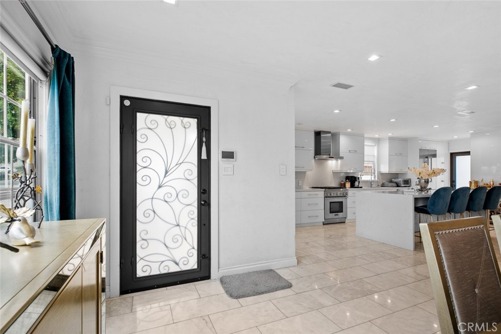 2640 North Keystone Street Burbank, CA 91504 - Photo 6 of 48 a kitchen with refrigerator and cabinets