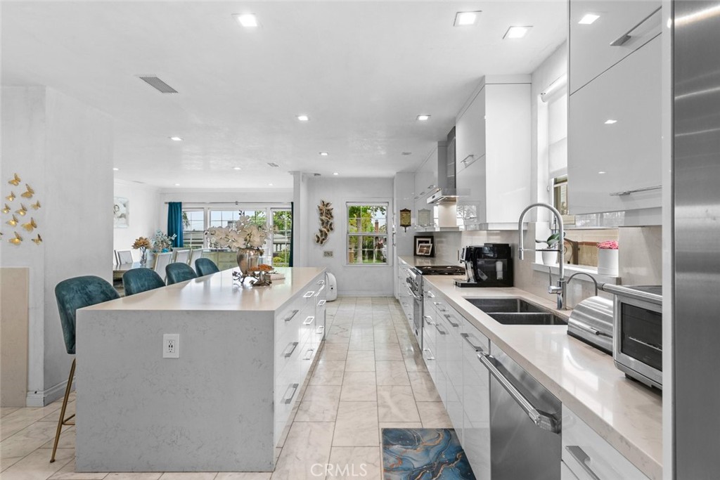 2640 North Keystone Street Burbank, CA 91504 - Photo 9 of 48 a large kitchen with stainless steel appliances lots of counter top space