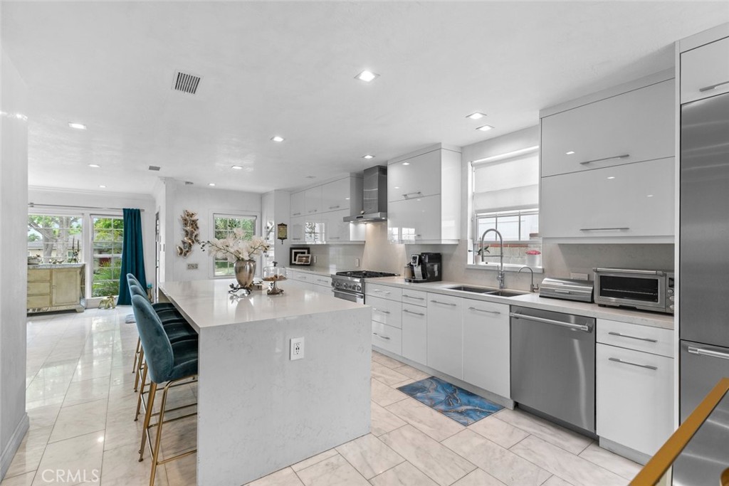 2640 North Keystone Street Burbank, CA 91504 - Photo 10 of 48 a kitchen with counter top space appliances and cabinets