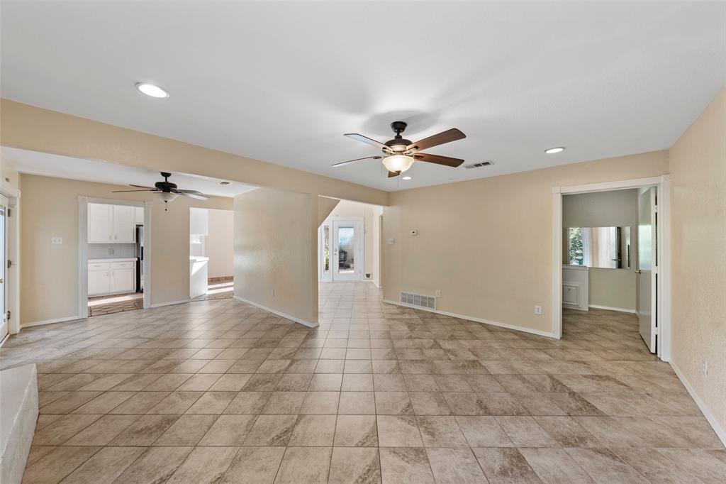 3825 North 30th Street Waco, TX 76708 - Photo 11 of 38 a view of a livingroom with a chandelier fan and windows