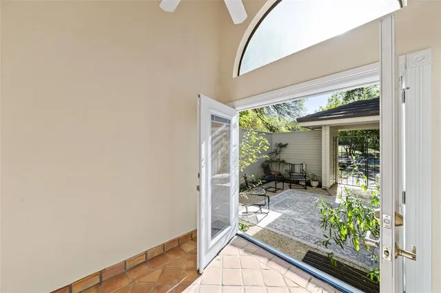 a kitchen with a refrigerator stove and white cabinets