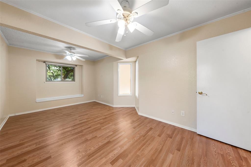 3825 North 30th Street Waco, TX 76708 - Photo 23 of 38 a view of an empty room with window and wooden floor