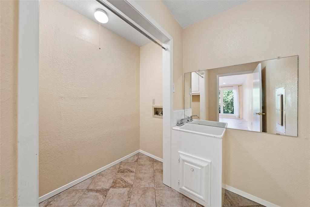 3825 North 30th Street Waco, TX 76708 - Photo 29 of 38 a view of a hallway with wooden floor and a kitchen