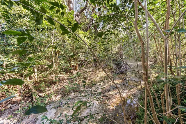 a view of balcony with wooden floor and seating space