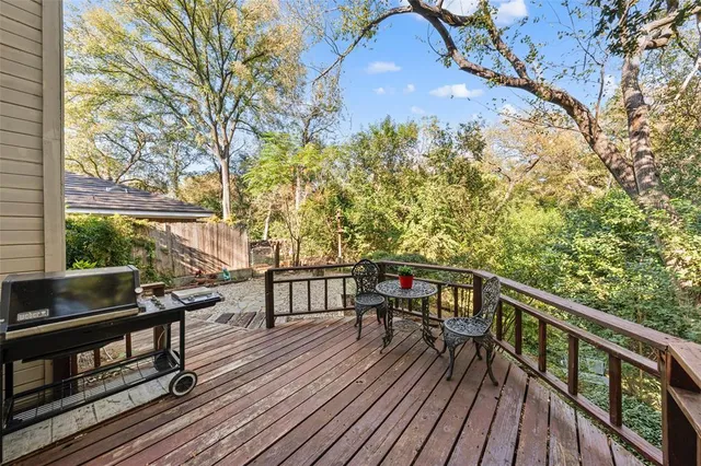 a view of balcony with wooden floor