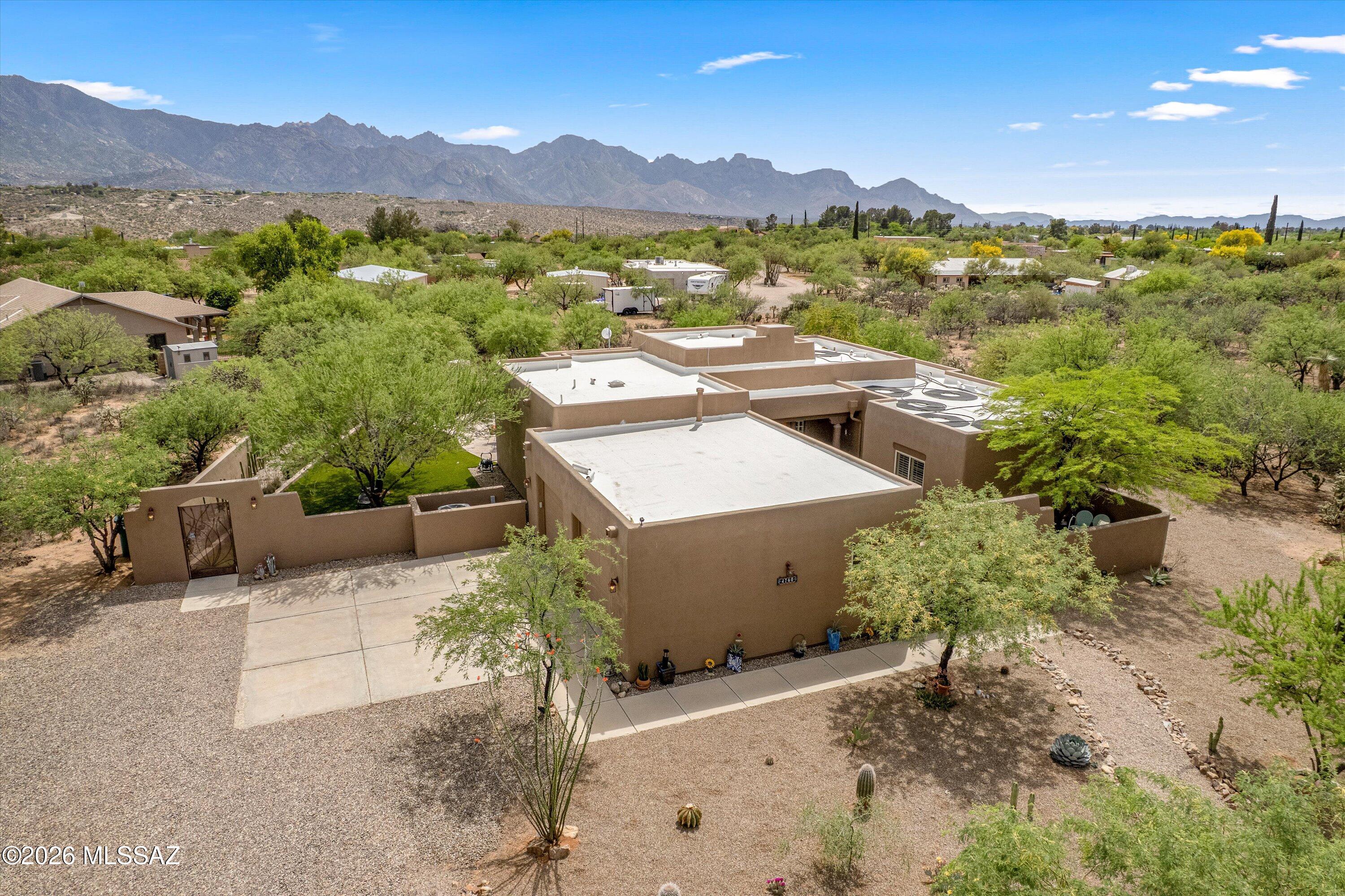 4760 East Wagon Train Road Tucson, AZ 85739 - Photo 36 of 38 a view of a terrace with a garden and mountain view