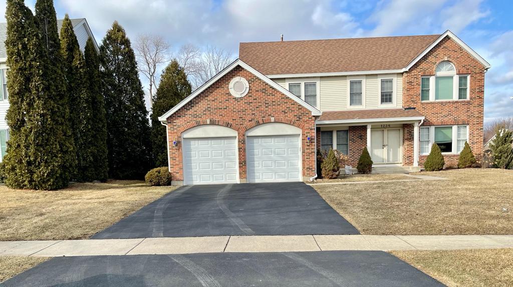 a view of a white house with a outdoor space