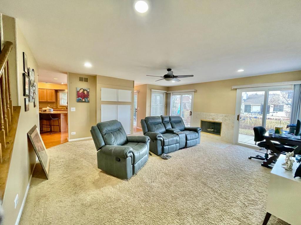 1236 Sagebrush Trail Cary, IL 60013 - Photo 4 of 17 a living room with furniture gym equipment and a large window