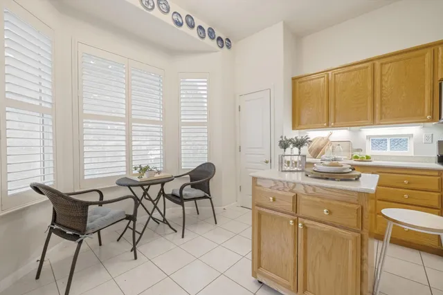 a kitchen with a cabinets and chairs