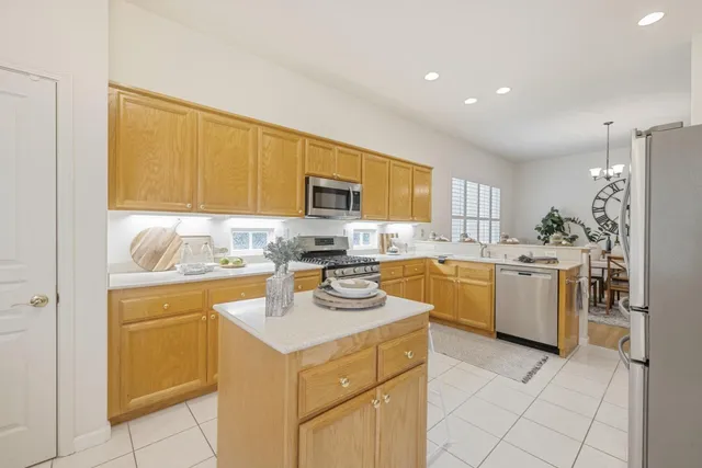 a kitchen with a sink cabinets and window