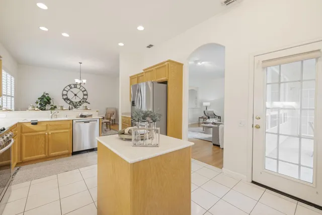 a bathroom with a double vanity sink mirror and toilet