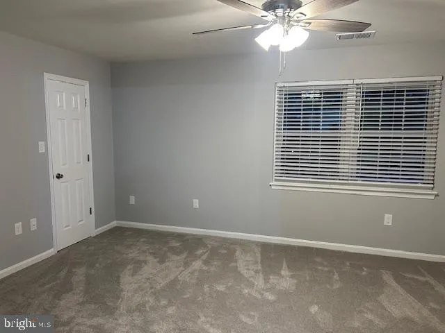 a bathroom with a glass door shower