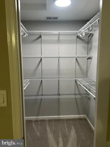 a bathroom with a sink vanity and mirror