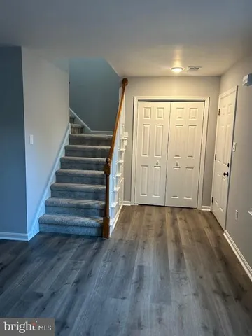 an empty room with wooden floor