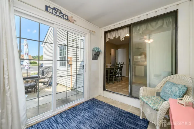 a view of an entryway with wooden floor