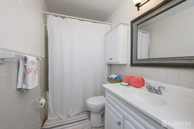 a bathroom with a sink toilet and vanity