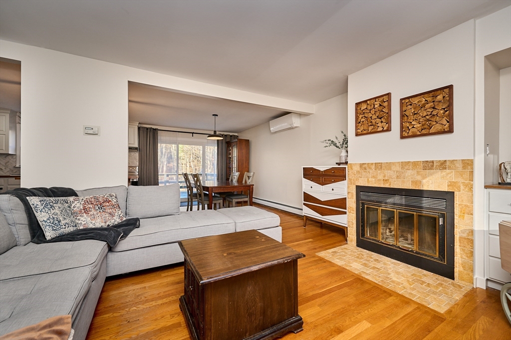 15 Gulf Road Pelham, MA 01002 - Photo 11 of 42 a living room with furniture and a fireplace