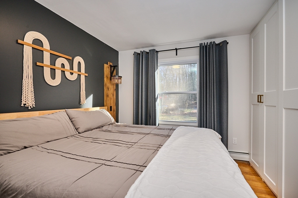 15 Gulf Road Pelham, MA 01002 - Photo 17 of 42 a bedroom with a bed and a window