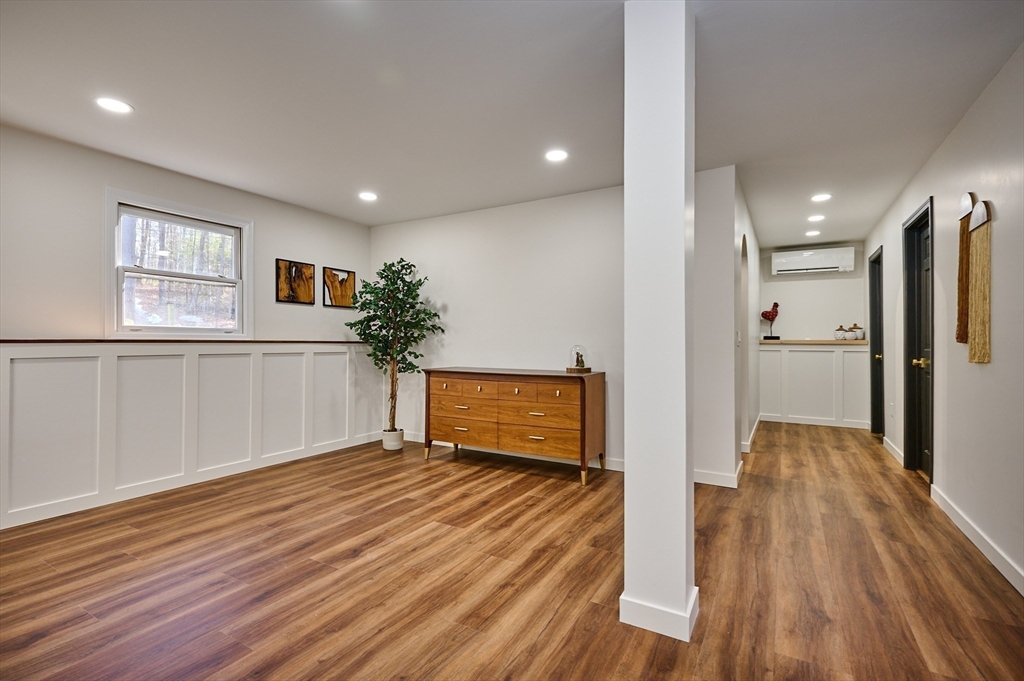 15 Gulf Road Pelham, MA 01002 - Photo 22 of 42 a view of a room with wooden floor and a ceiling fan