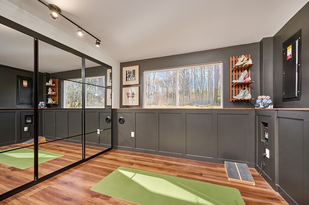 15 Gulf Road Pelham, MA 01002 - Photo 24 of 42 a bedroom with a bed and a flat tv screen on dresser